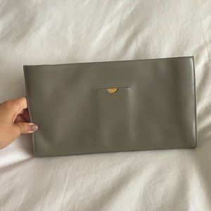 THE ROW - tan/cream “Wrap” calf leather clutch